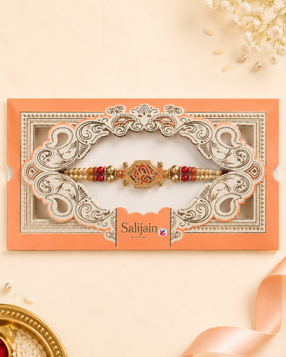 Rakhi/ Raki Om with beads Orange (Online exclusive)
