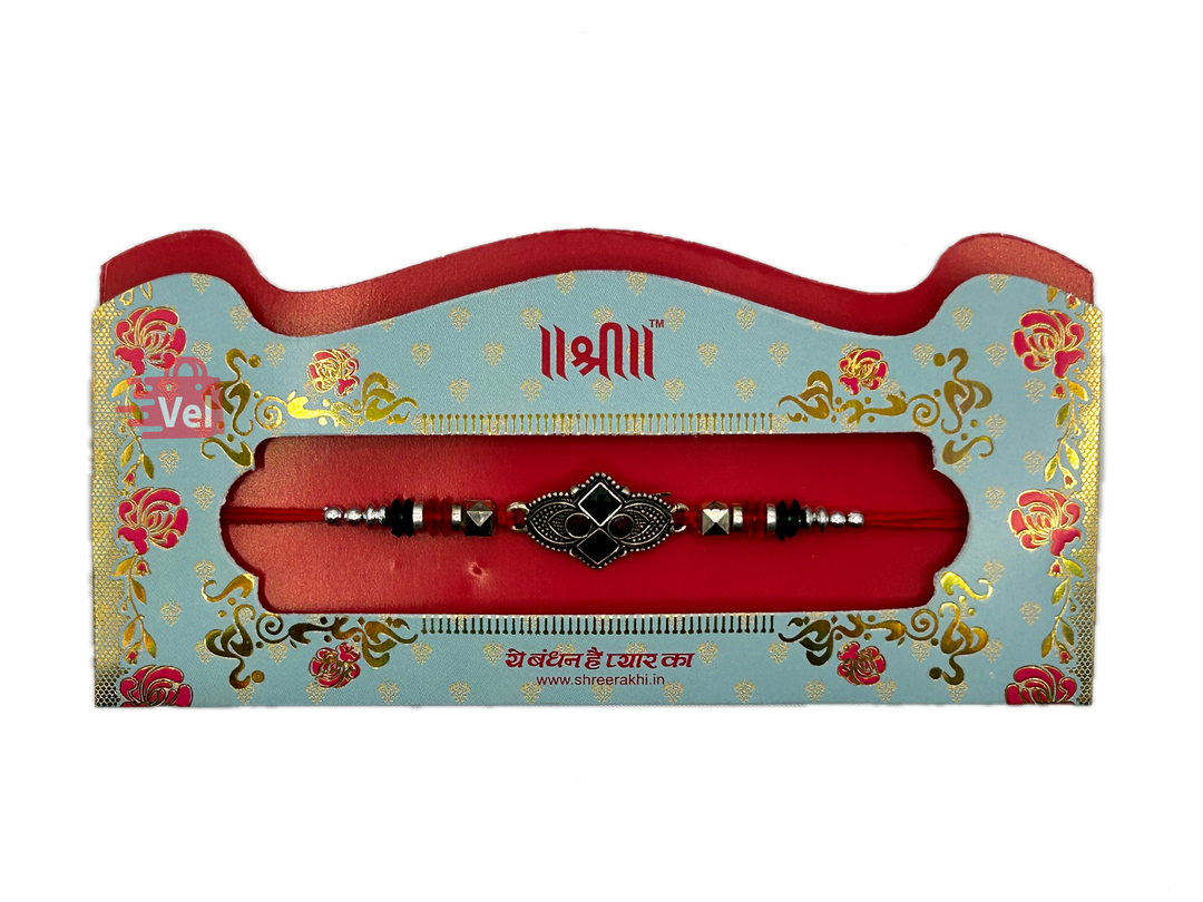 Silver rakhi with red stones (Online exclusive)