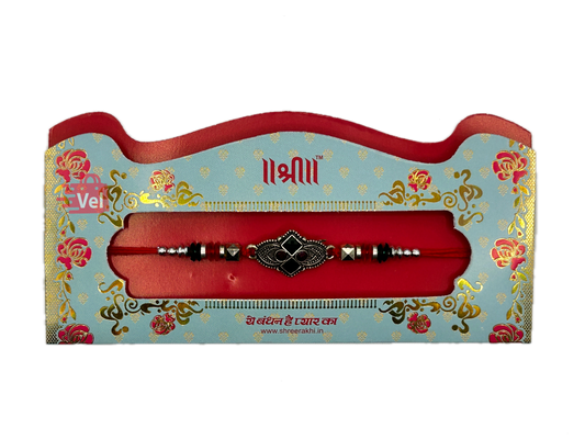 Silver rakhi with red stones (Online exclusive)
