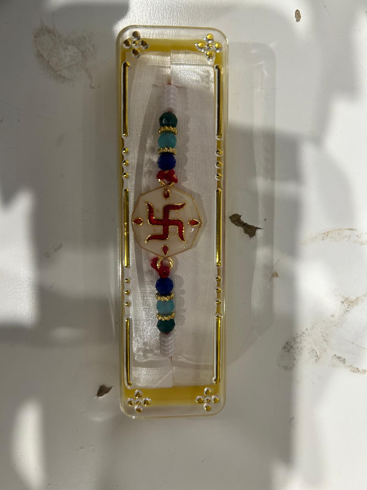 Rakhi/ Raki Multi Colour Swastik with Beads (Online exclusive)